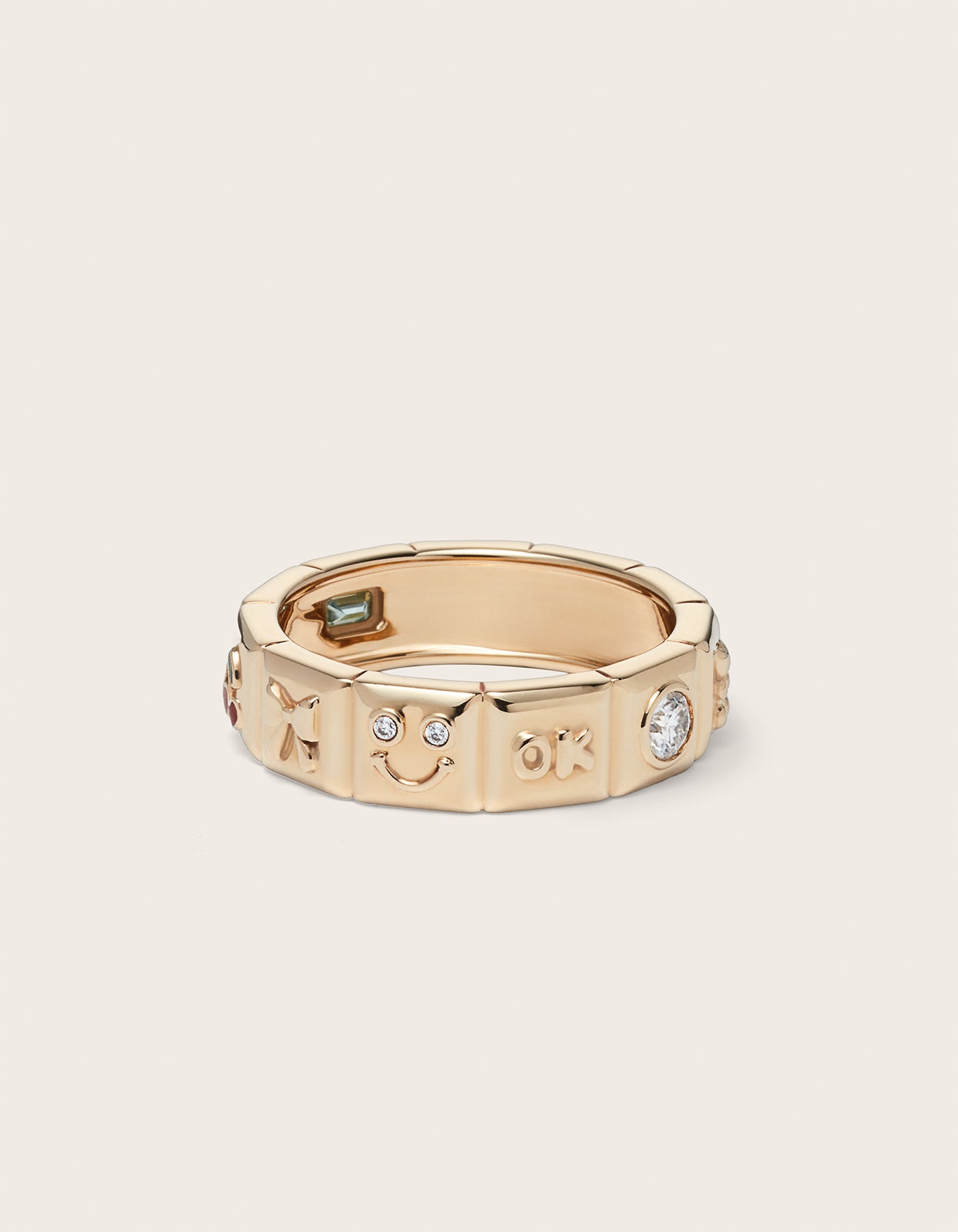Front view of 14k yellow gold Chiara Charm Ring with lab-grown diamonds, with a focus on the smiley charm