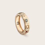 Side view of 14K yellow gold Chiara Charm Ring with lab-grown diamonds, with a focus on the green stone