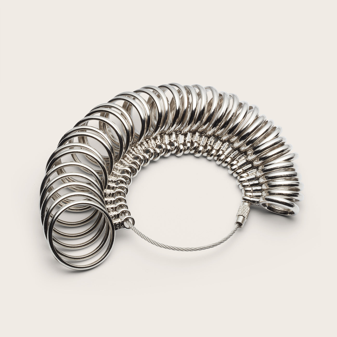 Metal ring sizer on a white background.