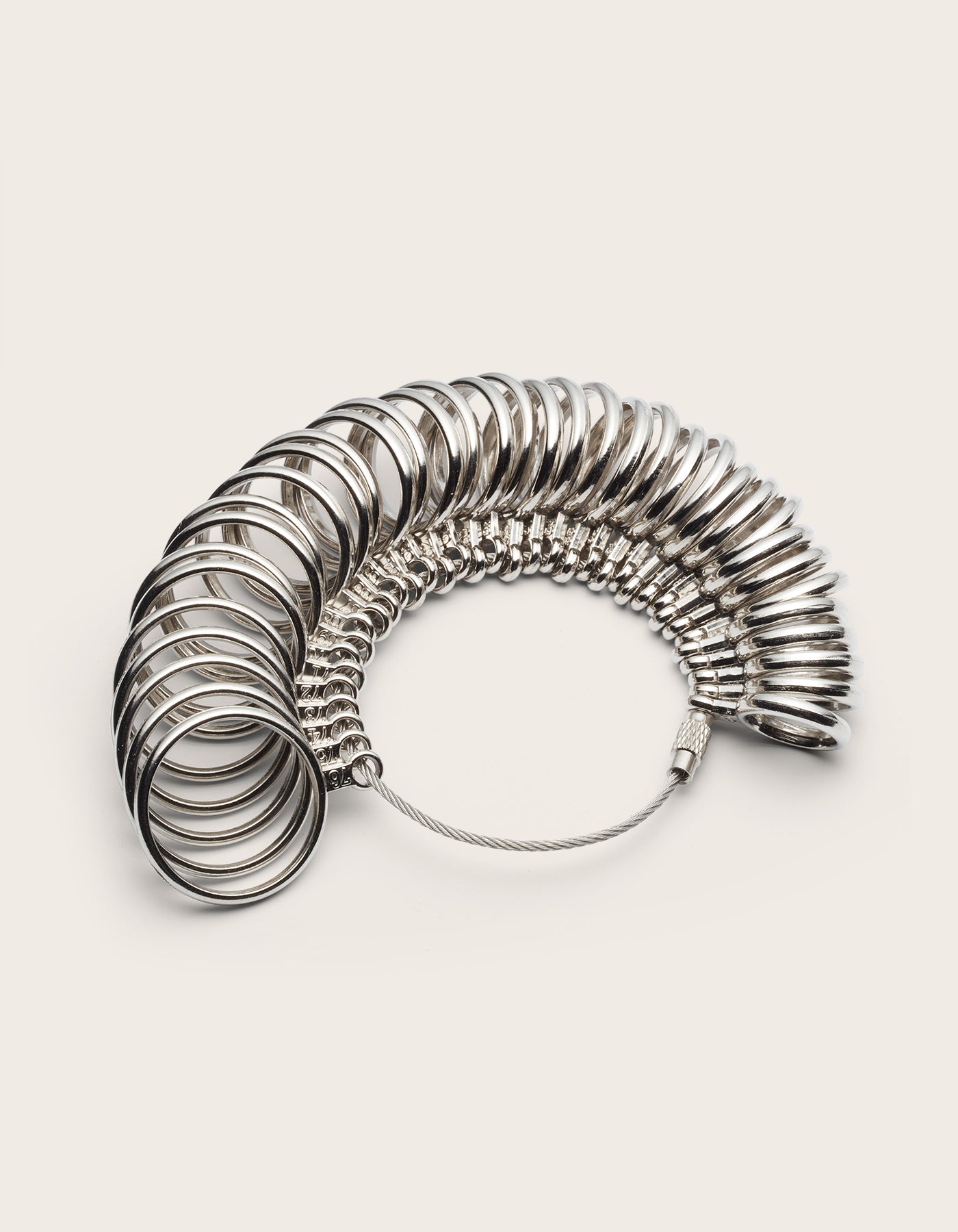 Metal ring sizer on a white background.